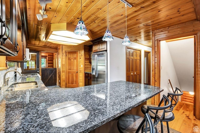 11996 S 3600 W, Riverton, UT 84065 - kitchen with stainless steel fridge with ice dispenser, wooden ceiling, a peninsula, light wood-type flooring, and a sink