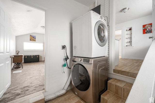 6 Park Ave, Tooele, UT 84074 - laundry room featuring stacked washer and clothes dryer and baseboards