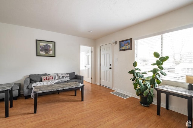 6 Park Ave, Tooele, UT 84074 - living room featuring light wood-style floors and baseboards