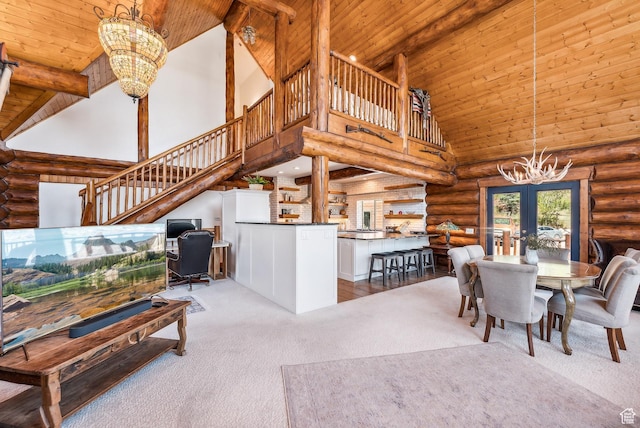 6690 N State Road 32, Peoa, UT 84061 - dining space with carpet, log walls, wood ceiling, a chandelier, and stairs