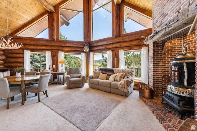 6690 N State Road 32, Peoa, UT 84061 - living area featuring rustic walls, carpet floors, an inviting chandelier, wood ceiling, and a wood stove