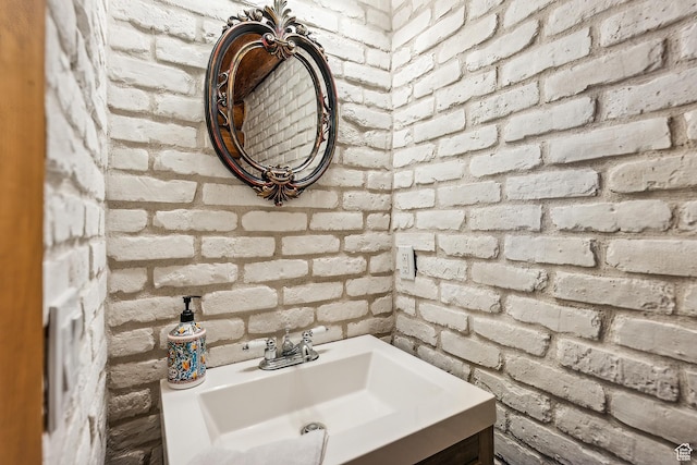 6690 N State Road 32, Peoa, UT 84061 - bathroom featuring brick wall and vanity