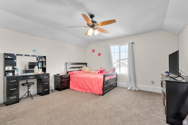 carpeted bedroom with baseboards, a textured ceiling, a ceiling fan, and vaulted ceiling