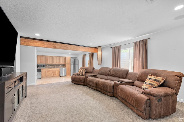 living area with recessed lighting, light colored carpet, and a textured ceiling