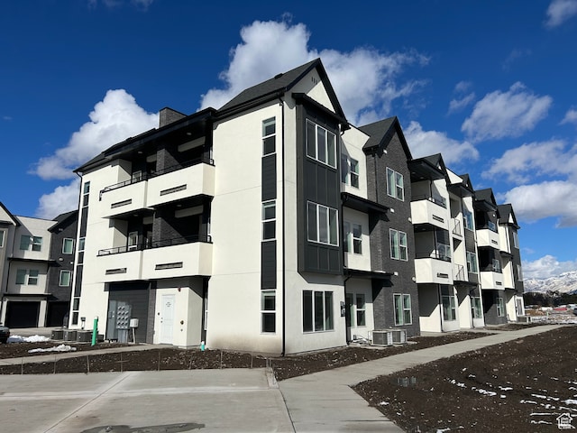 view of building exterior featuring central AC