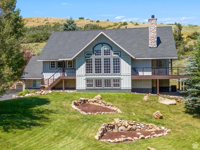 9065 Meadow Dr, Sundance, UT 84604 - rear view of property with stairway, a yard, board and batten siding, and a chimney