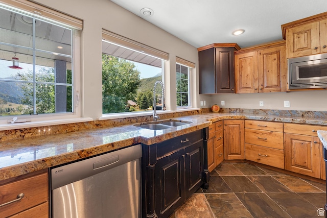 9065 Meadow Dr, Sundance, UT 84604 - kitchen with a sink, stone finish flooring, recessed lighting, stainless steel appliances, and light stone countertops