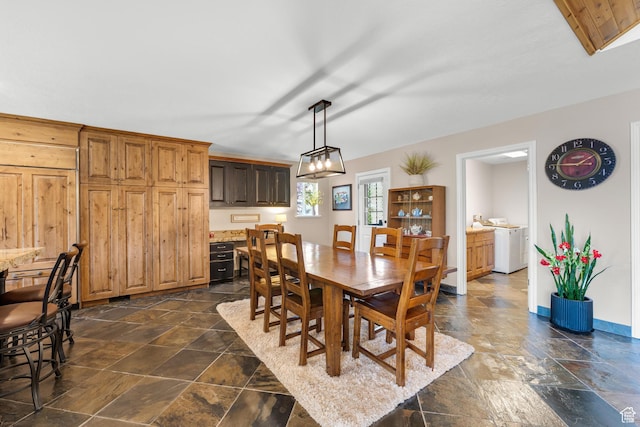 9065 Meadow Dr, Sundance, UT 84604 - dining area with stone finish flooring, baseboards, and an inviting chandelier