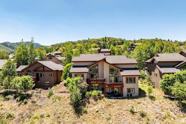 8389 N Pointe Dr, Park City, UT 84098 - rear view of property with a mountain view and roof with shingles