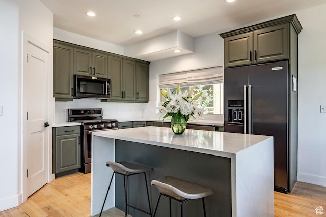 8389 N Pointe Dr, Park City, UT 84098 - kitchen featuring stainless steel range with gas cooktop, decorative backsplash, light wood-style flooring, light stone countertops, and fridge with ice dispenser