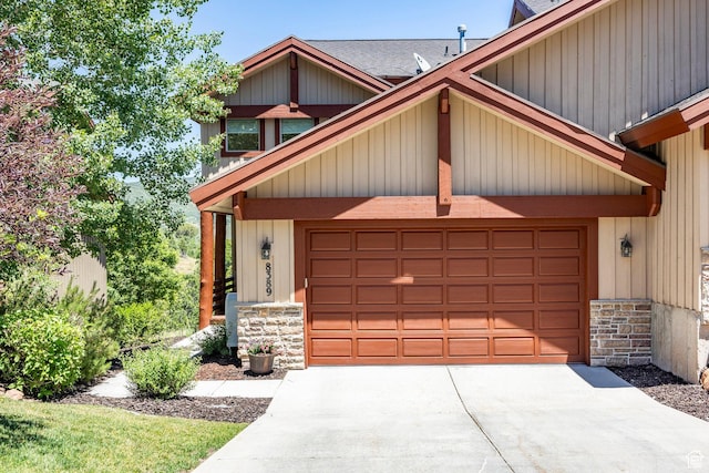 8389 N Pointe Dr, Park City, UT 84098 - view of front of home with stone siding and concrete driveway