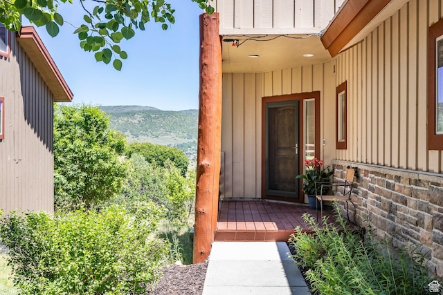 8389 N Pointe Dr, Park City, UT 84098 - view of exterior entry featuring a mountain view and board and batten siding