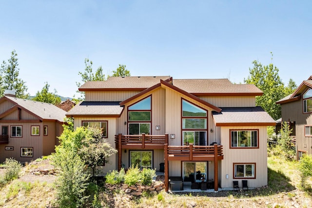 8389 N Pointe Dr, Park City, UT 84098 - back of property with a deck and roof with shingles