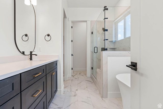 bathroom with a shower stall, a freestanding tub, marble finish floor, and baseboards