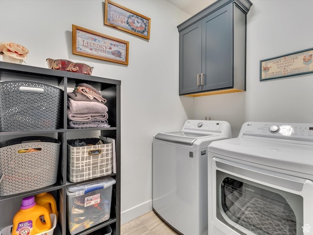 8257 N Sandalwood Ln, Park City, UT 84098 - laundry area with separate washer and dryer, light hardwood / wood-style flooring, and cabinets