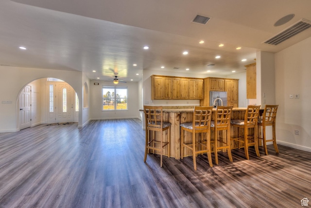 4119 Valle Del Sol Dr, Moab, UT 84532 - kitchen with stainless steel fridge with ice dispenser, arched walkways, ceiling fan, and visible vents