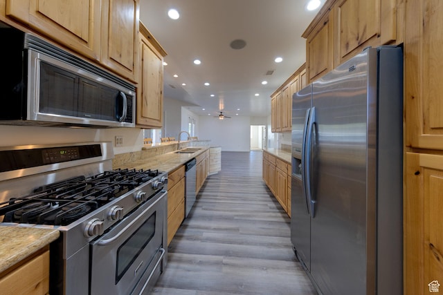 4119 Valle Del Sol Dr, Moab, UT 84532 - kitchen featuring a sink, recessed lighting, light wood finished floors, and stainless steel appliances
