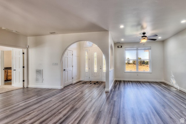 4119 Valle Del Sol Dr, Moab, UT 84532 - foyer featuring arched walkways, baseboards, a ceiling fan, and wood finished floors