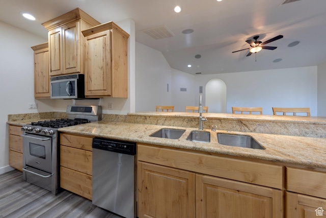 4119 Valle Del Sol Dr, Moab, UT 84532 - kitchen featuring light brown cabinets, visible vents, ceiling fan, stainless steel appliances, and a sink