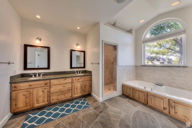 4119 Valle Del Sol Dr, Moab, UT 84532 - bathroom featuring a tile shower, a bath, double vanity, and a sink