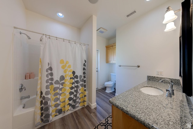 4119 Valle Del Sol Dr, Moab, UT 84532 - bathroom with shower / bath combination with curtain, vanity, visible vents, toilet, and wood finished floors