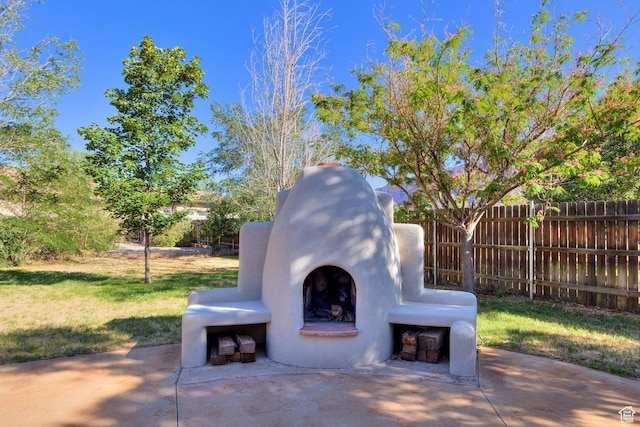 4119 Valle Del Sol Dr, Moab, UT 84532 - view of patio with fence and exterior fireplace