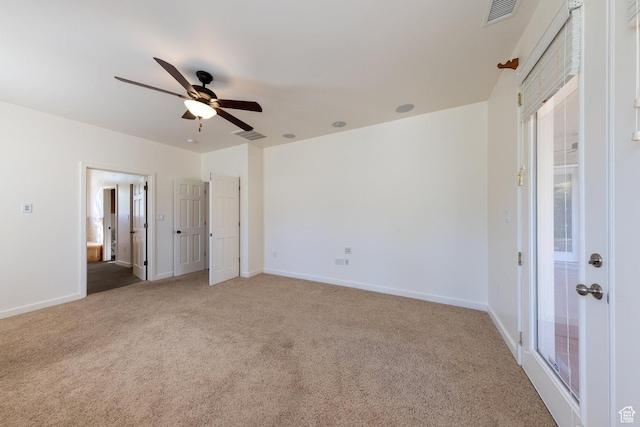 4119 Valle Del Sol Dr, Moab, UT 84532 - unfurnished bedroom with visible vents, baseboards, a ceiling fan, ensuite bath, and light carpet