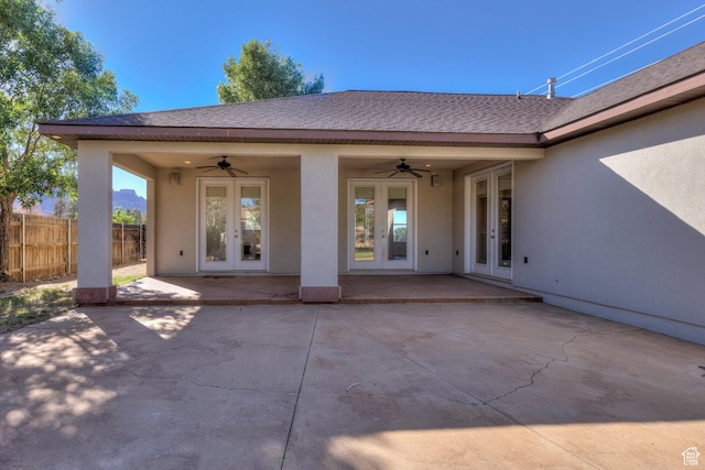 4119 Valle Del Sol Dr, Moab, UT 84532 - rear view of property with french doors, fence, stucco siding, and ceiling fan