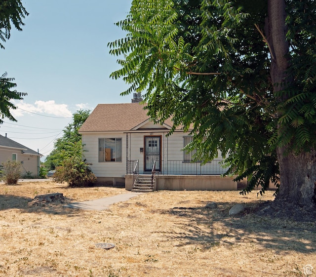 465 N 100 E, Tooele, UT 84074 - view of front of property featuring a chimney and a shingled roof