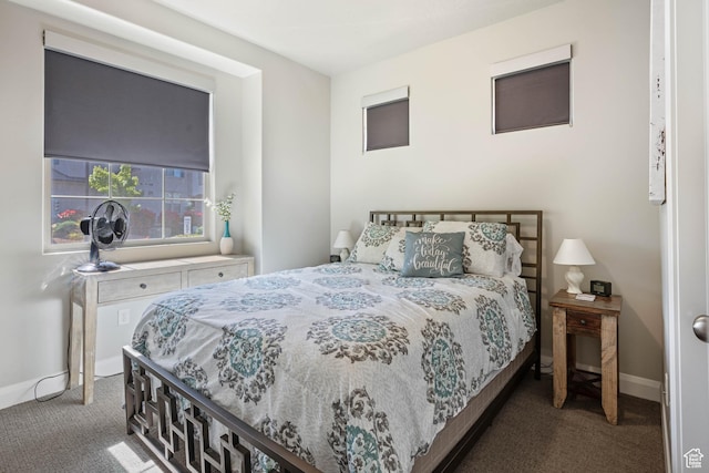 bedroom featuring carpet flooring and baseboards