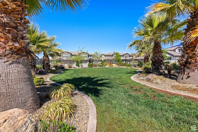 view of yard with a residential view and a fenced backyard