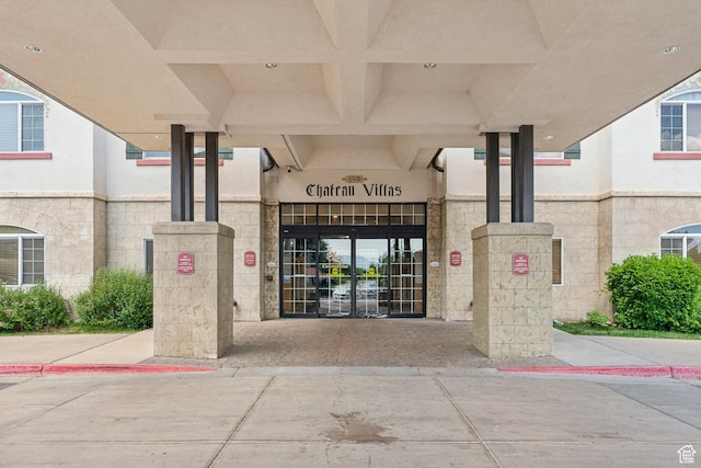 view of exterior entry featuring central AC