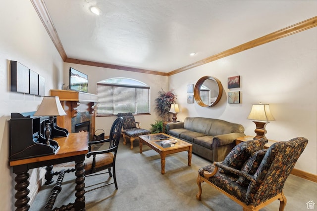 living room featuring light carpet, a high end fireplace, and ornamental molding