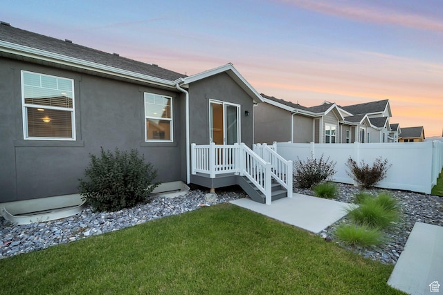 6618 N Furner Rdg, Eagle Mountain, UT 84005 - back house at dusk with a lawn