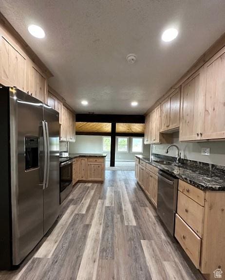 3715 W 11500 N, Neola, UT 84053 - kitchen featuring light brown cabinetry, appliances with stainless steel finishes, sink, hardwood / wood-style flooring, and dark stone counters