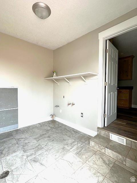 3715 W 11500 N, Neola, UT 84053 - clothes washing area with gas dryer hookup, a textured ceiling, and washer hookup