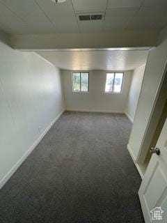 38 E 500 N, Tooele, UT 84074 - basement featuring visible vents, carpet flooring, a drop ceiling, and baseboards
