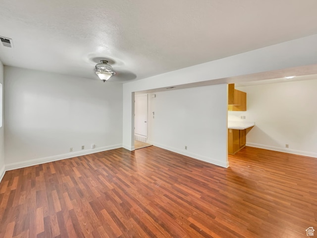 1227 Riverside Ave Unit 50, Provo, UT 84604 - spare room with dark hardwood / wood-style floors and a textured ceiling