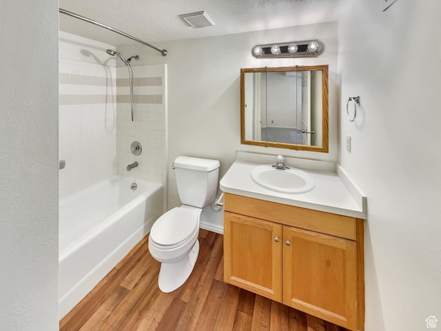 1227 Riverside Ave Unit 50, Provo, UT 84604 - full bathroom featuring tiled shower / bath, vanity, toilet, and hardwood / wood-style floors