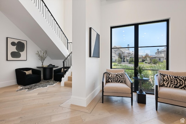 3905 S Quarry Ridge Dr, St George, UT 84790 - living area featuring light hardwood / wood-style flooring and a high ceiling