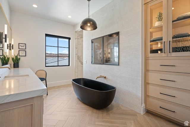 3905 S Quarry Ridge Dr, St George, UT 84790 - bathroom featuring vanity, a tub to relax in, and parquet flooring
