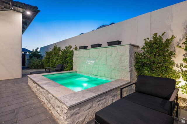 3905 S Quarry Ridge Dr, St George, UT 84790 - view of swimming pool with a jacuzzi and a patio