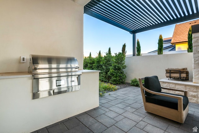 3905 S Quarry Ridge Dr, St George, UT 84790 - view of patio / terrace featuring area for grilling, a pergola, and exterior kitchen