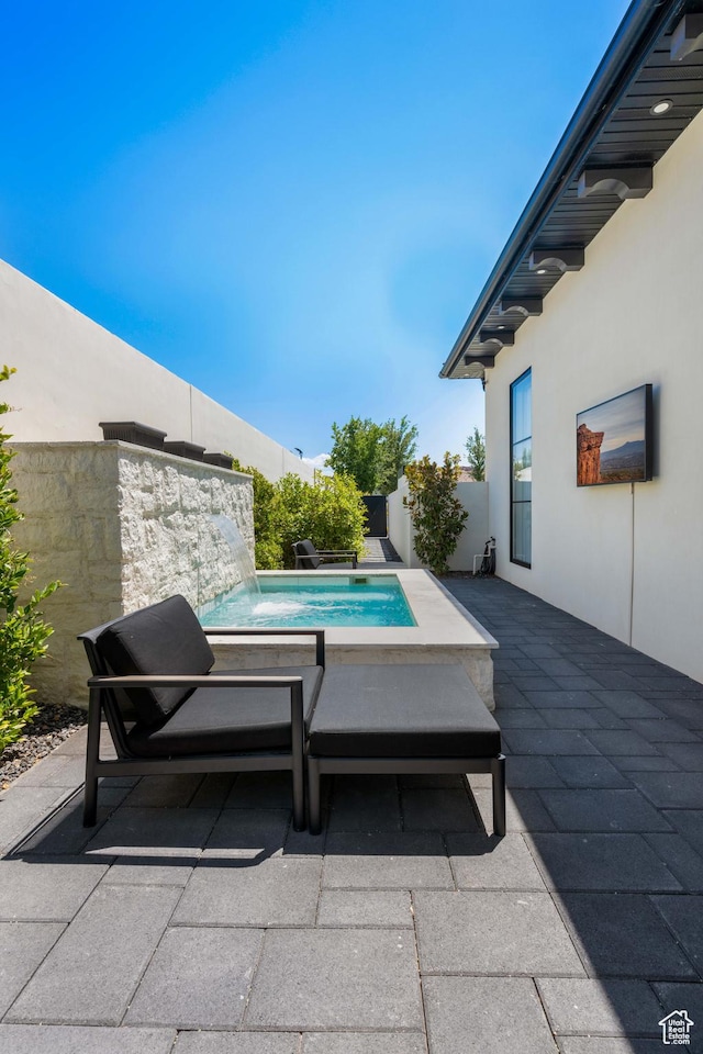 3905 S Quarry Ridge Dr, St George, UT 84790 - view of swimming pool featuring pool water feature and a patio area