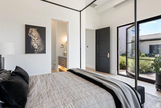 3905 S Quarry Ridge Dr, St George, UT 84790 - bedroom with connected bathroom and multiple windows