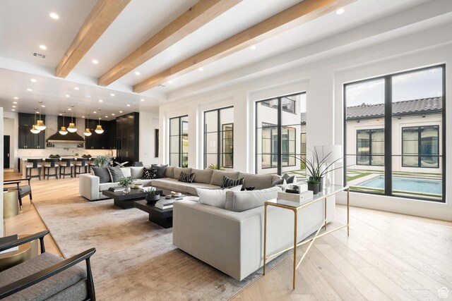 3905 S Quarry Ridge Dr, St George, UT 84790 - living room with beamed ceiling and light hardwood / wood-style floors