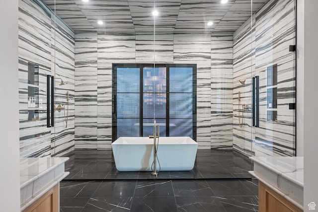 3905 S Quarry Ridge Dr, St George, UT 84790 - bathroom with vanity, tile walls, and plus walk in shower