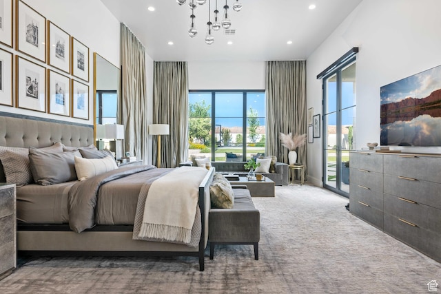 3905 S Quarry Ridge Dr, St George, UT 84790 - carpeted bedroom with an inviting chandelier and access to exterior