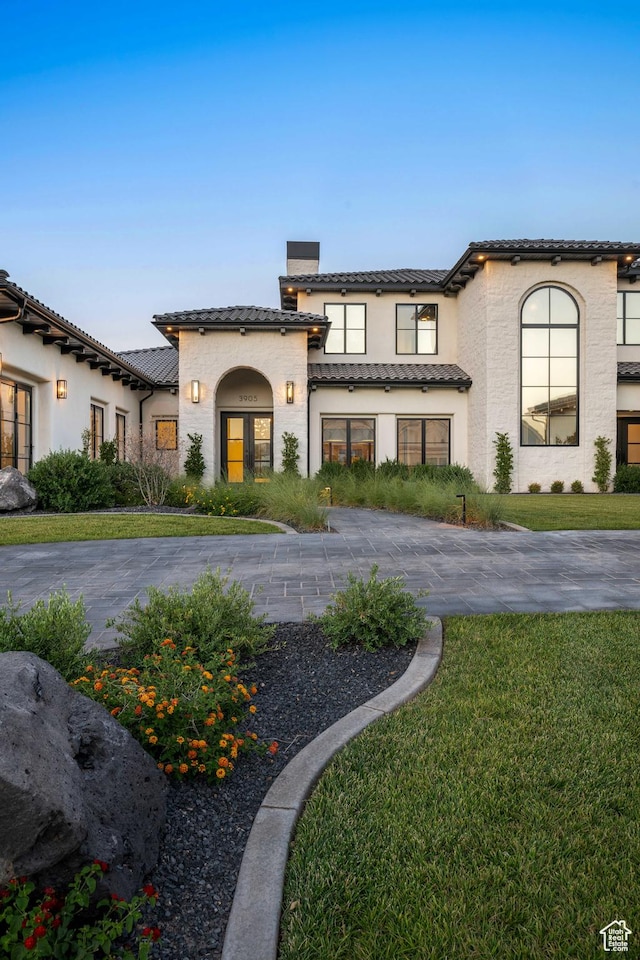 3905 S Quarry Ridge Dr, St George, UT 84790 - mediterranean / spanish house featuring a front lawn