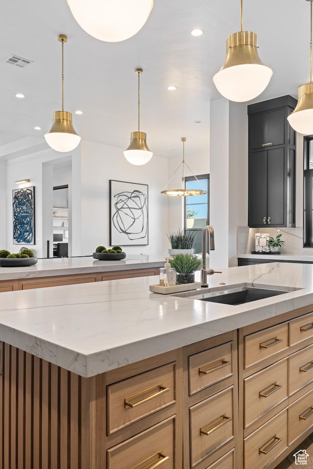 3905 S Quarry Ridge Dr, St George, UT 84790 - kitchen with hanging light fixtures and light stone countertops